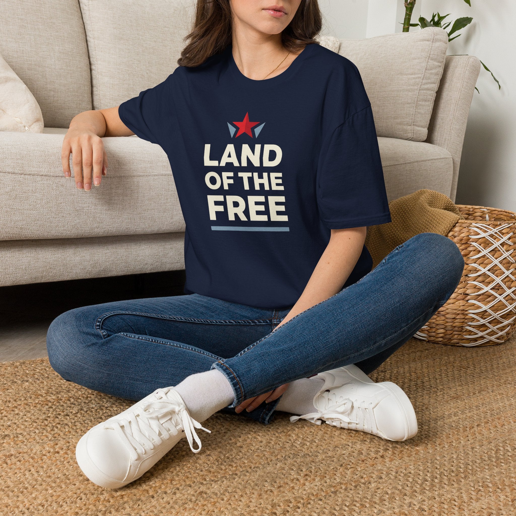 Navy T-shirt with red star graphic and white Land of the Free text