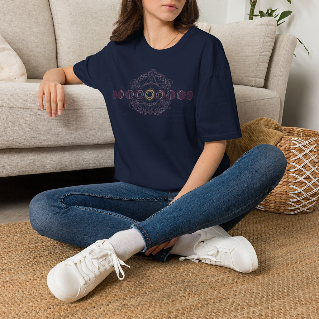 Navy T-shirt worn by model with pink moon-phase circular geometric chest graphic