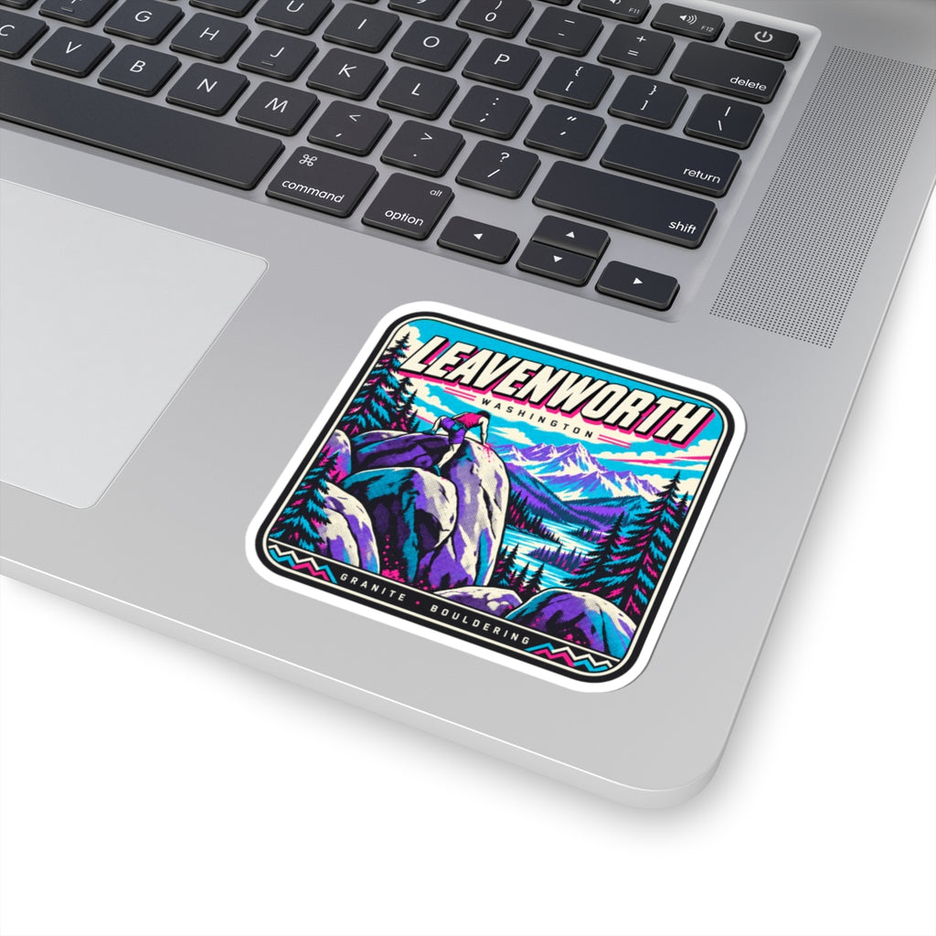 Kiss-cut bouldering sticker on laptop keyboard, featuring Leavenworth mountain art