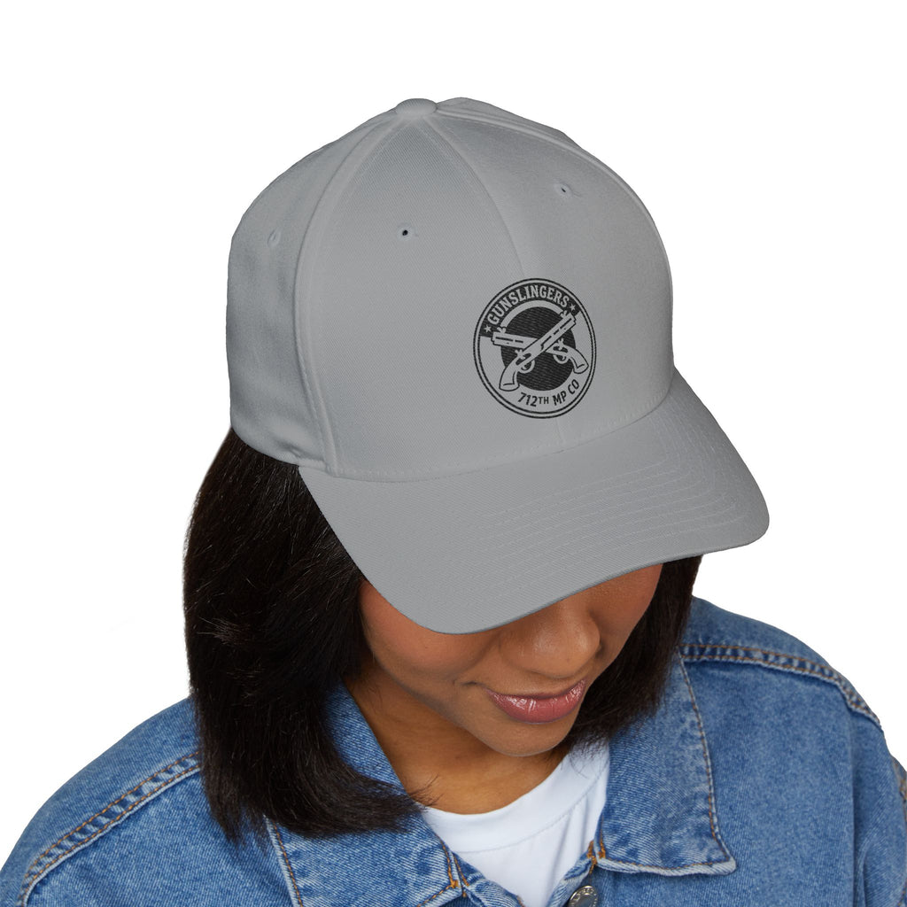 Light grey embroidered baseball cap with circular emblem patch on front