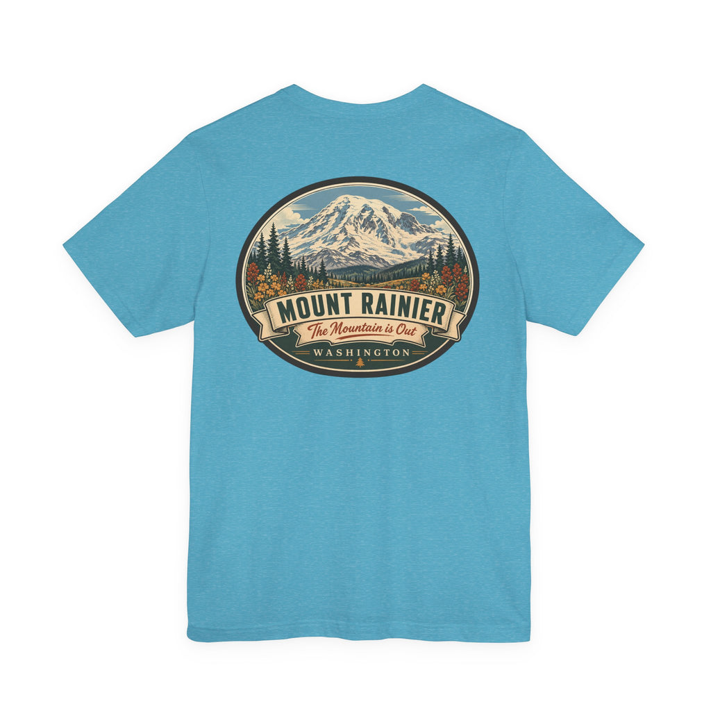Heather aqua graphic T-shirt with large circular mountain national park badge on chest.