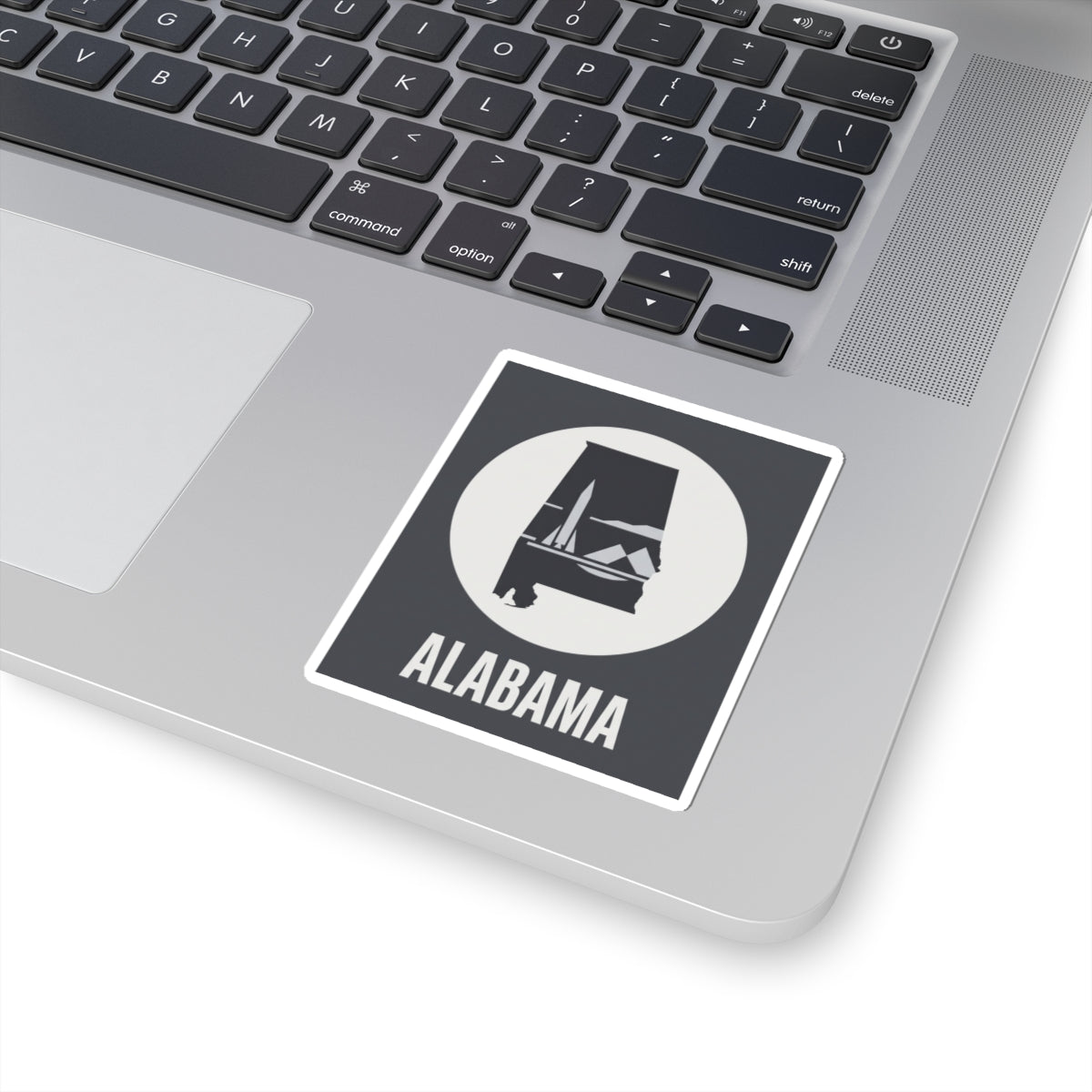 Alabama outline vinyl decal sticker with circular monument graphic and “ALABAMA” text, white border