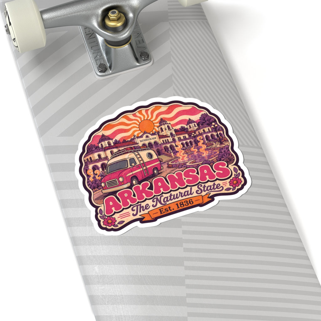 Kiss-cut Arkansas sticker on skateboard grip, with pink van, orange sun, and “The Natural State”