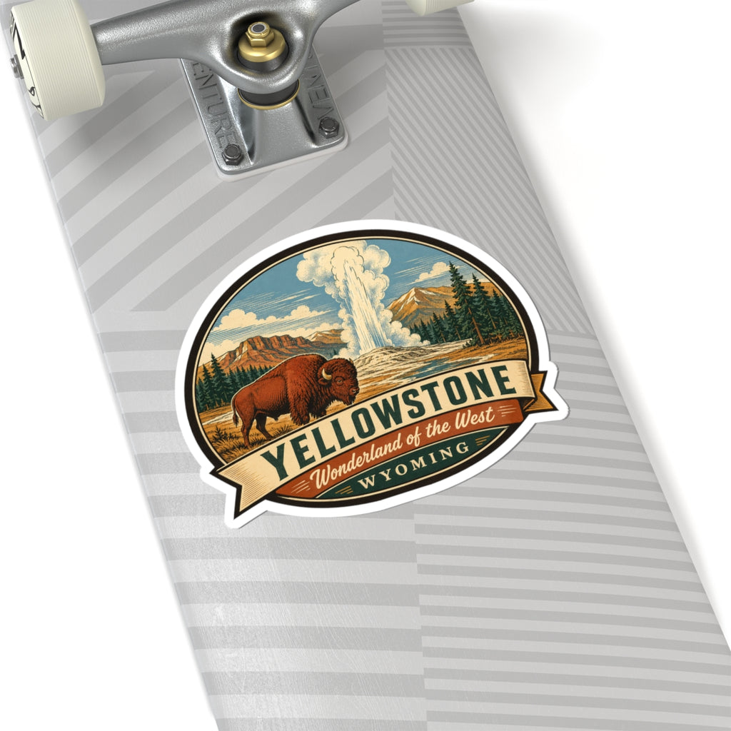 Yellowstone travel sticker on a notebook; round bison and geyser with Wyoming banner