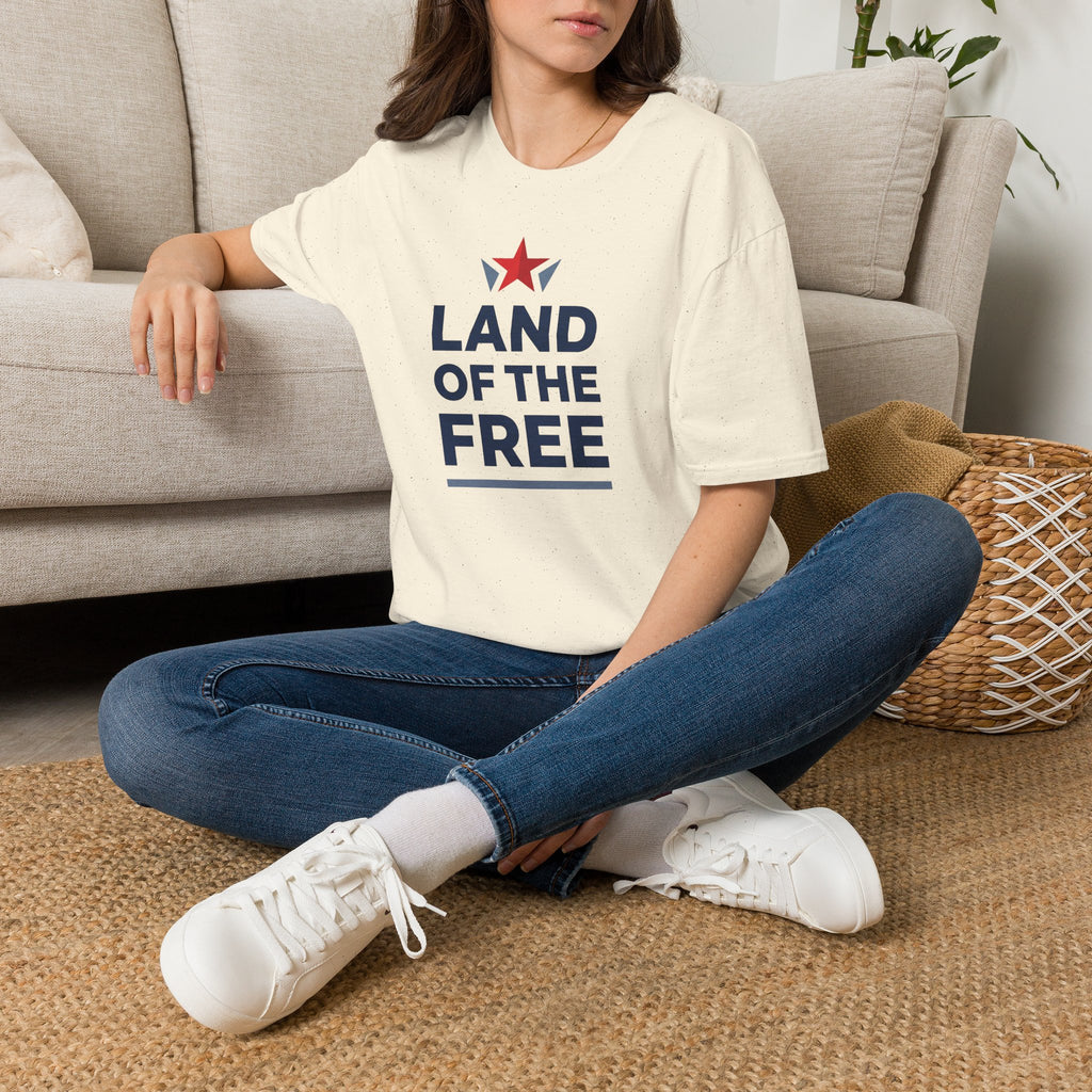 Cream short-sleeve T-shirt with “LAND OF THE FREE” text and red star graphic