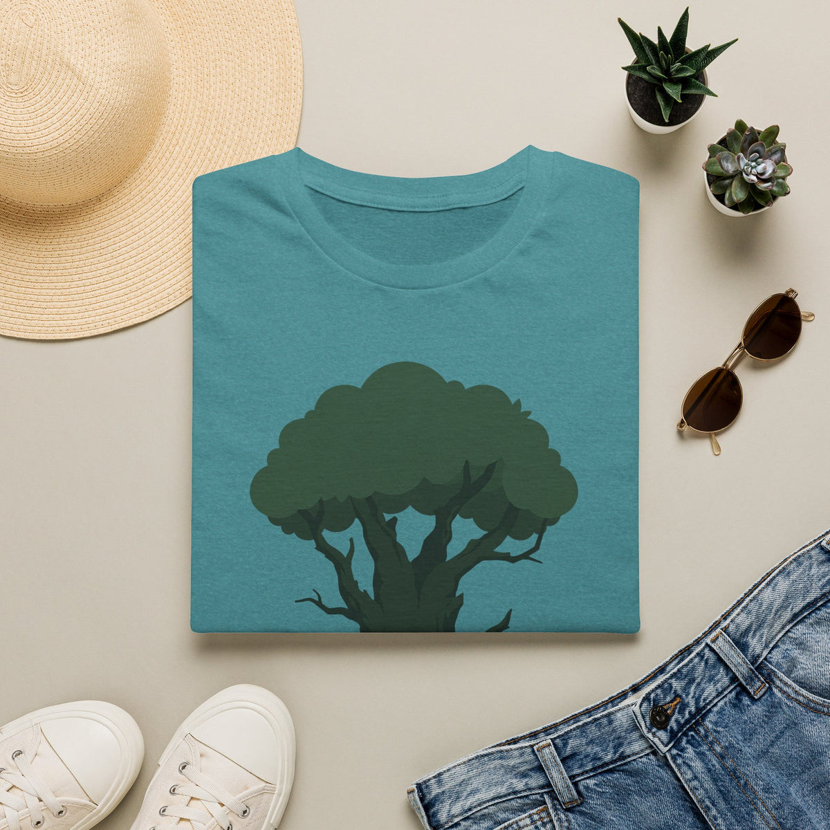 Teal T-shirt with green tree graphic and small yellow-orange door opening at trunk base