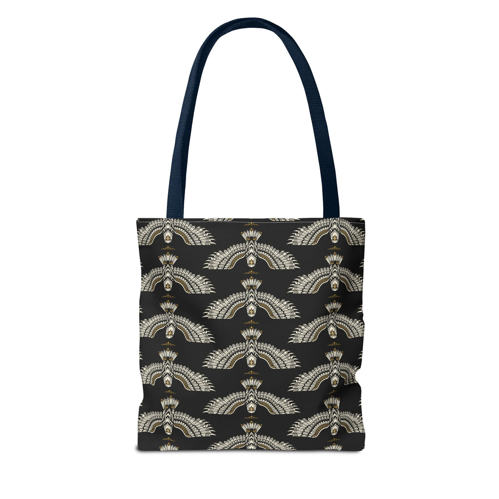 Black tote bag with repeating winged scarab motif in pale gold; navy shoulder strap