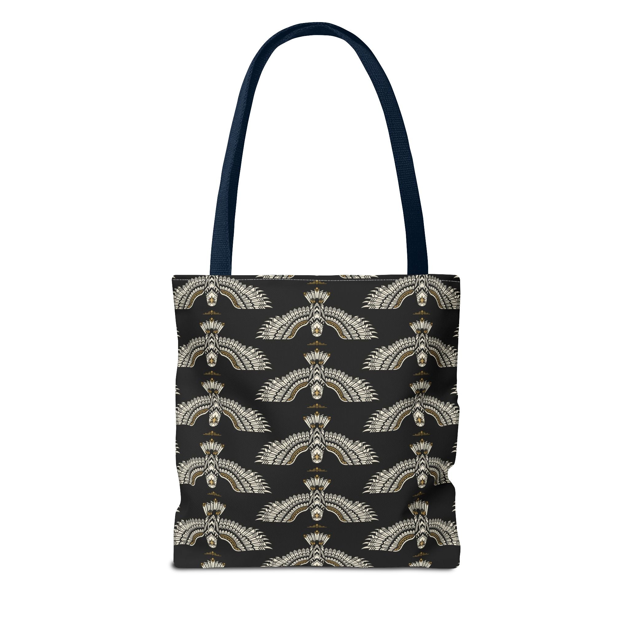 Black tote bag with repeating winged scarab motif in pale gold; navy shoulder strap