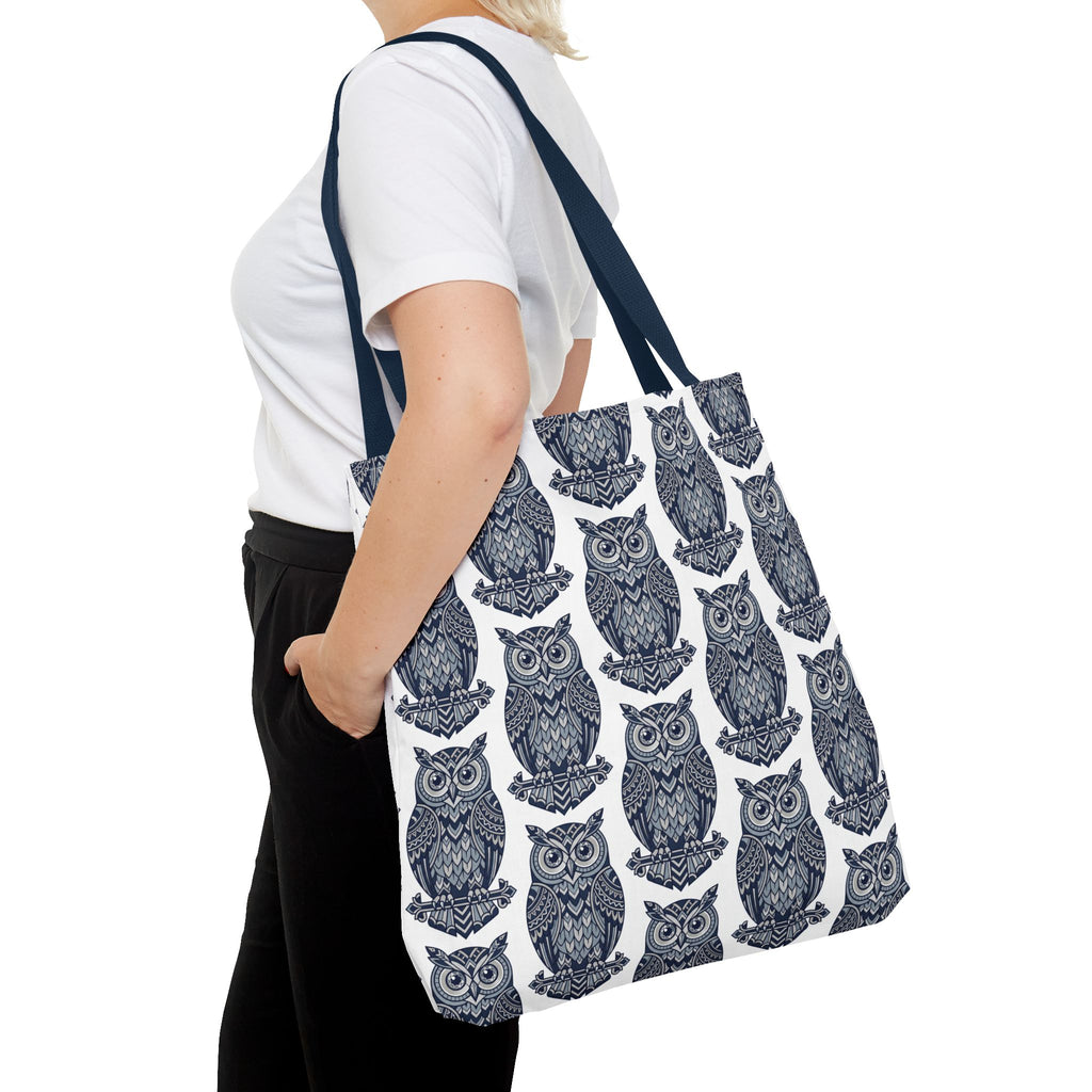 Owl tote bag with navy shoulder strap, blue and white owl print, side view on person