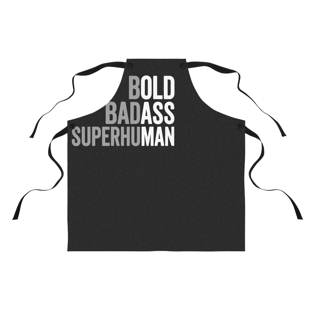 Black apron with bold 'BOLD BADASS SUPERHUMAN' text and neck ties