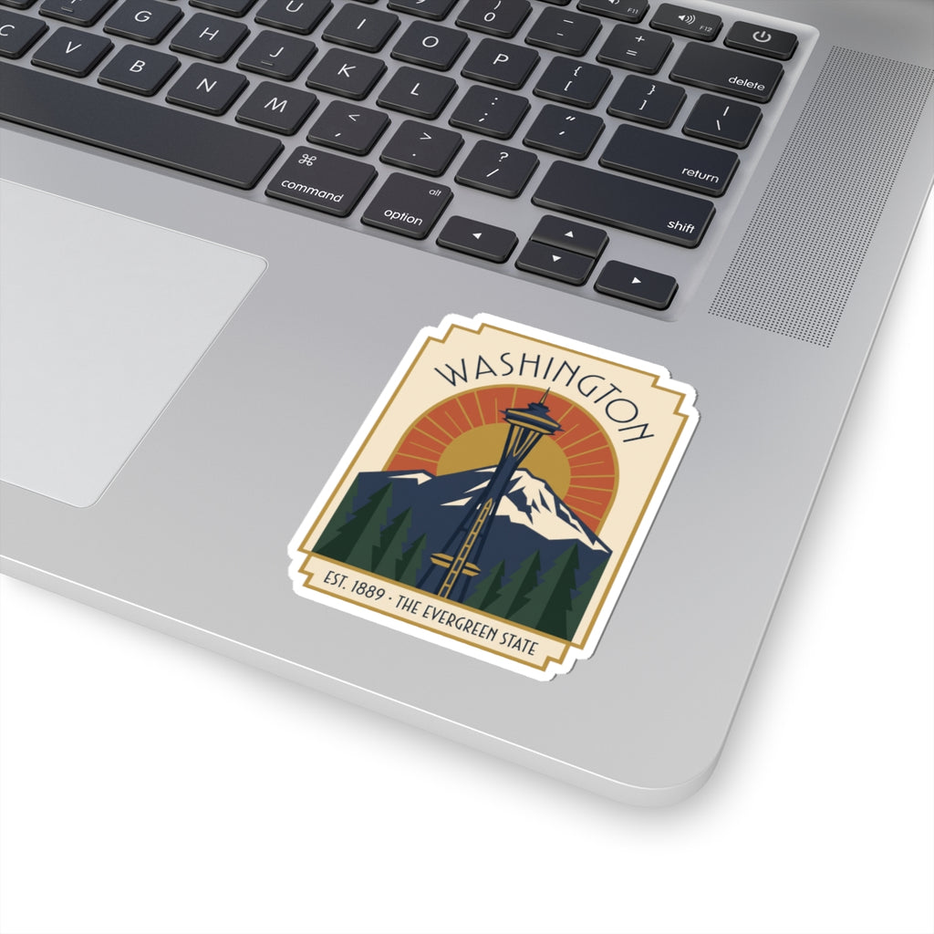 Washington sticker with Space Needle and mountain scene, shown on a laptop surface
