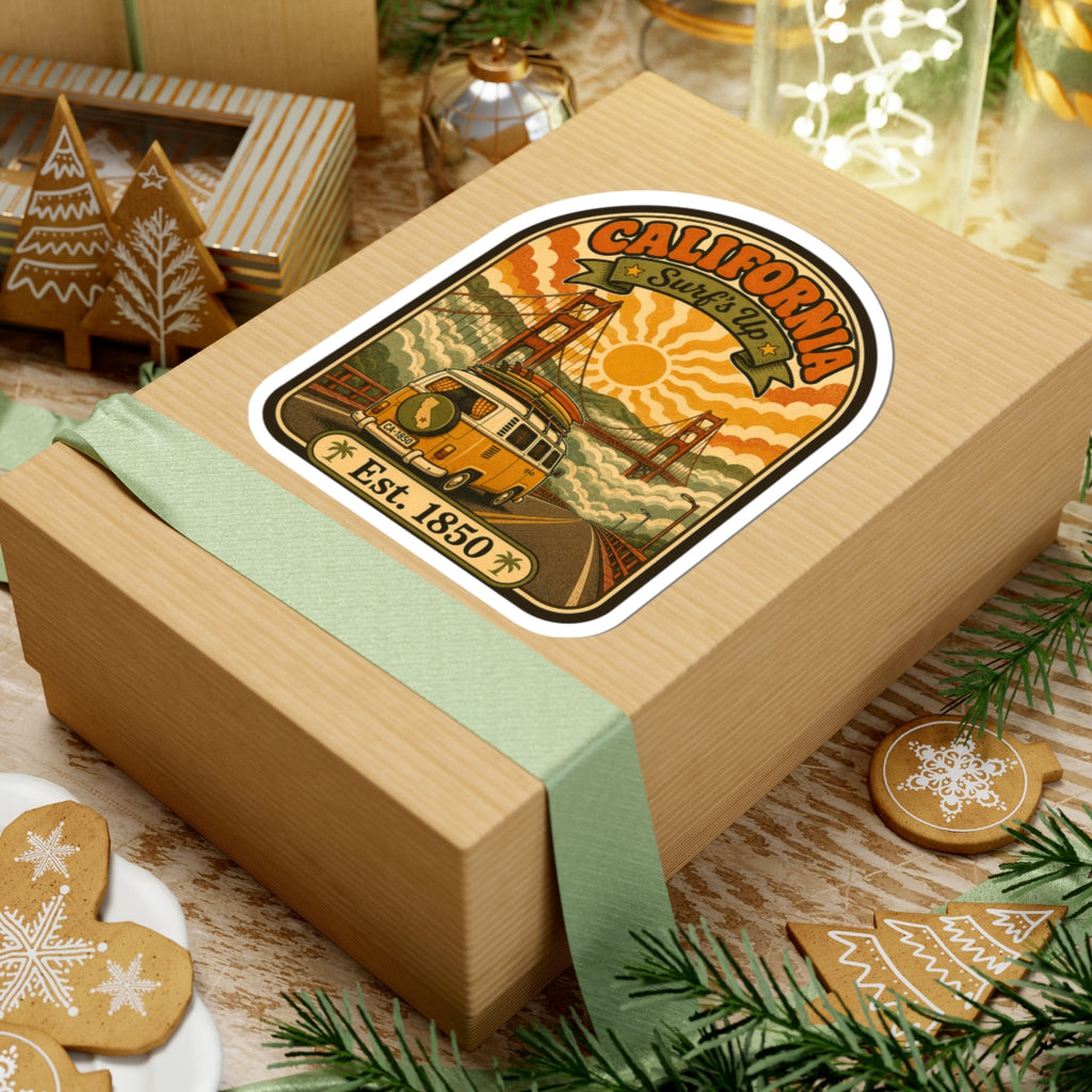 Retro California surf van sticker on a wrapped gift with bridge art and “Est. 1850”.