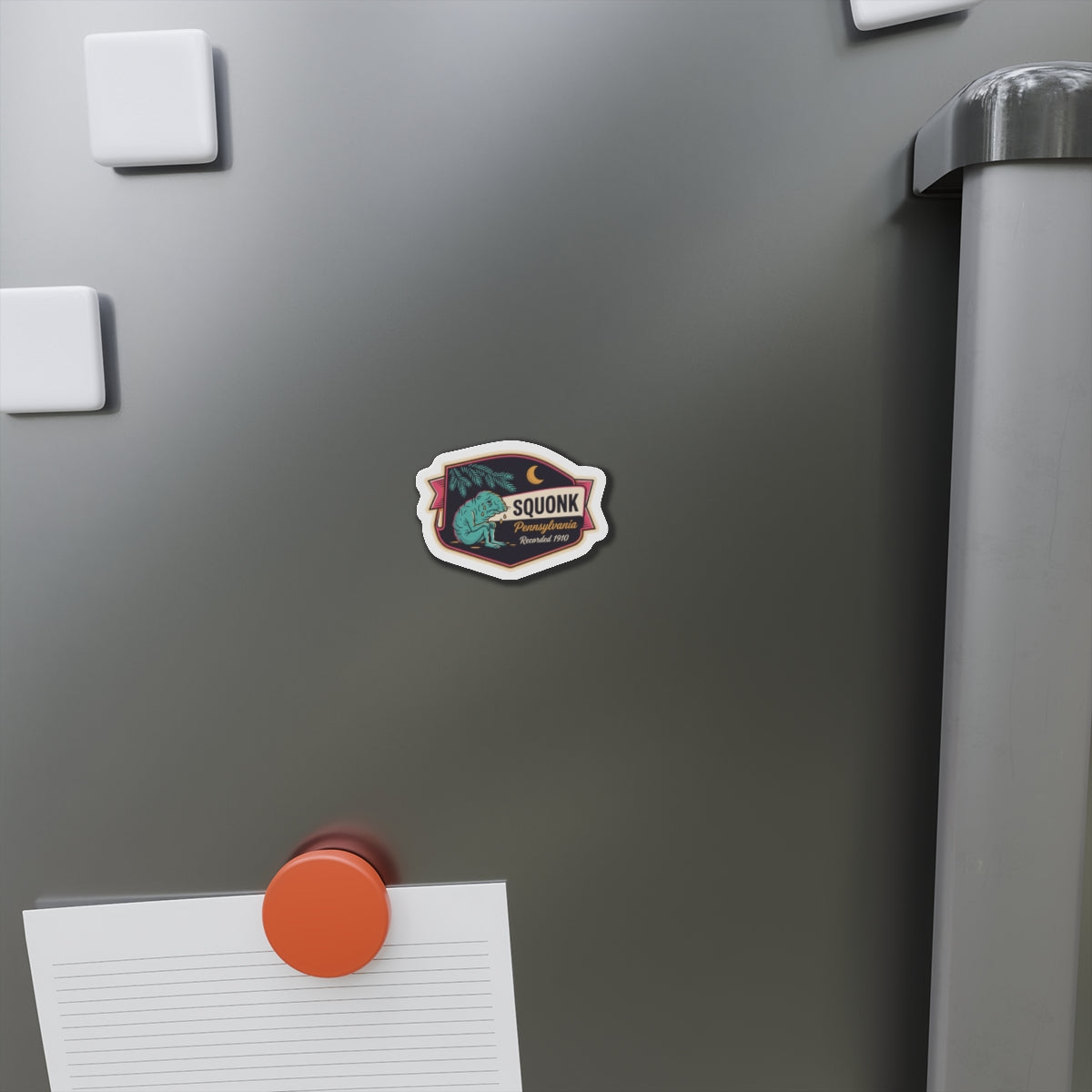 Die-cut SQUONK Pennsylvania logo magnet on a stainless refrigerator door