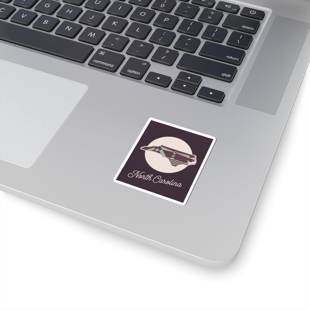 North Carolina state silhouette kiss-cut decal, square maroon design with white emblem