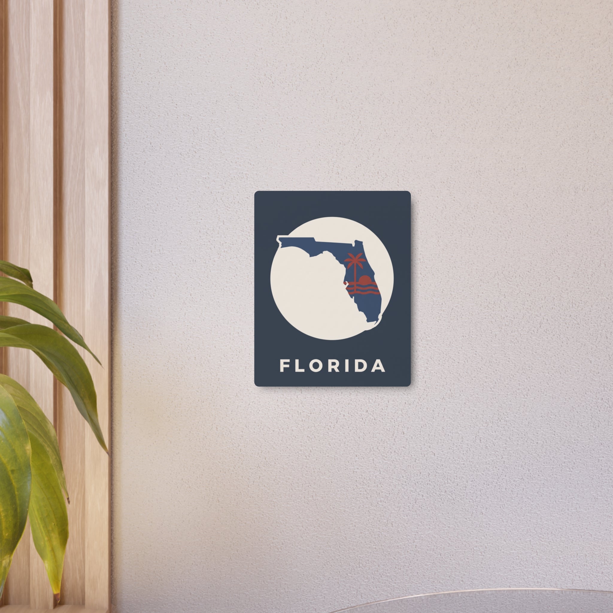 Florida metal art sign mounted on wall, blue square with white circle and 'FLORIDA'