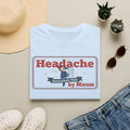 Light blue T-shirt with “Headache” graphic and banner text in red and blue