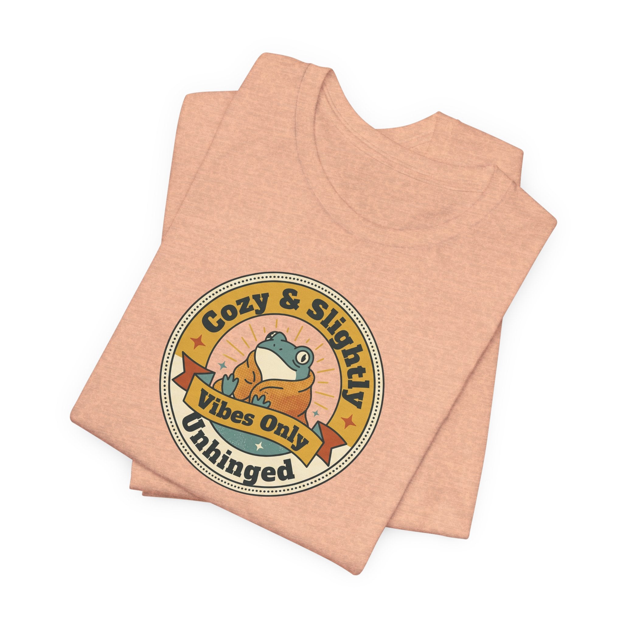 Heather peach T-shirt with round retro sloth logo graphic, folded
