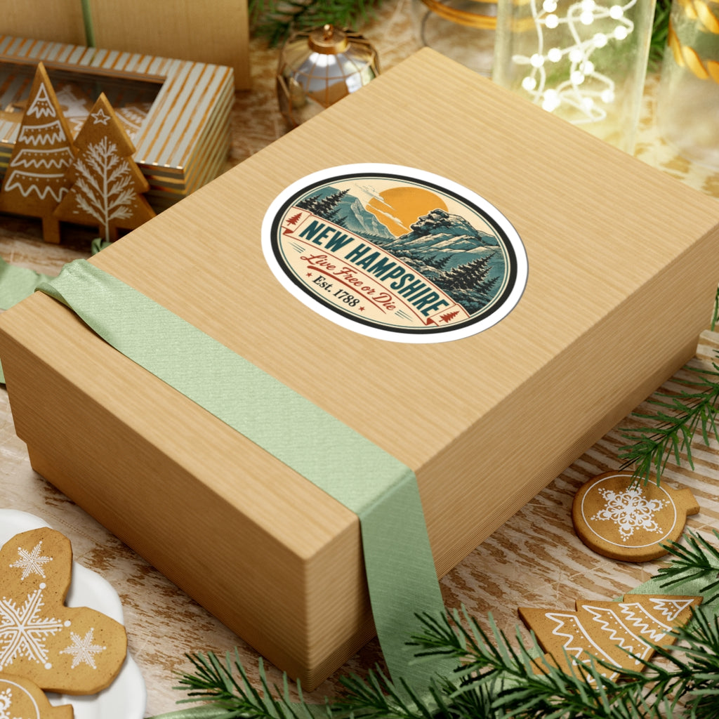 Round New Hampshire vinyl decal sticker on a wrapped gift box, mountain scene and Est. 1788