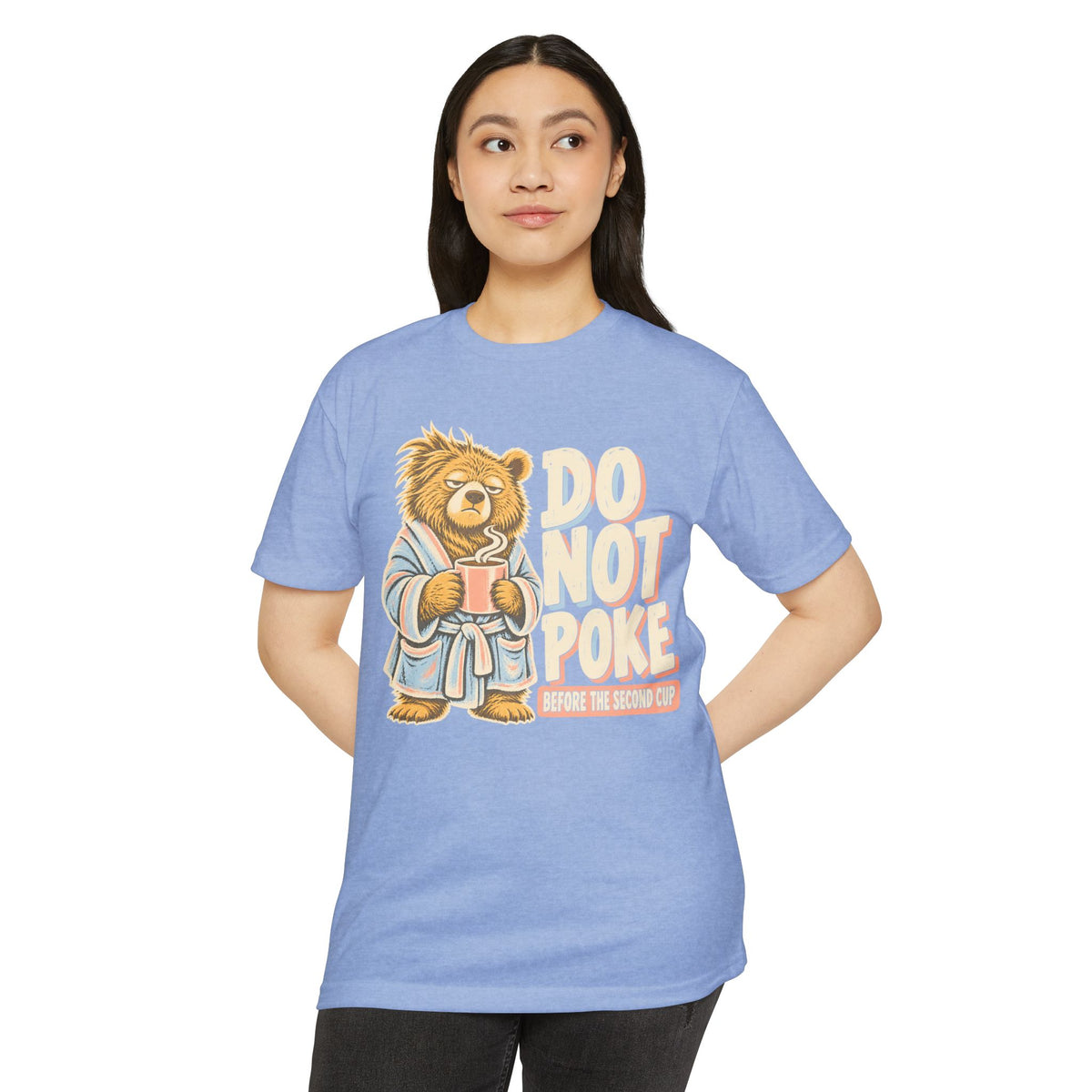 Light blue t-shirt with grumpy bear holding a cup and “DO NOT POKE” graphic on front.