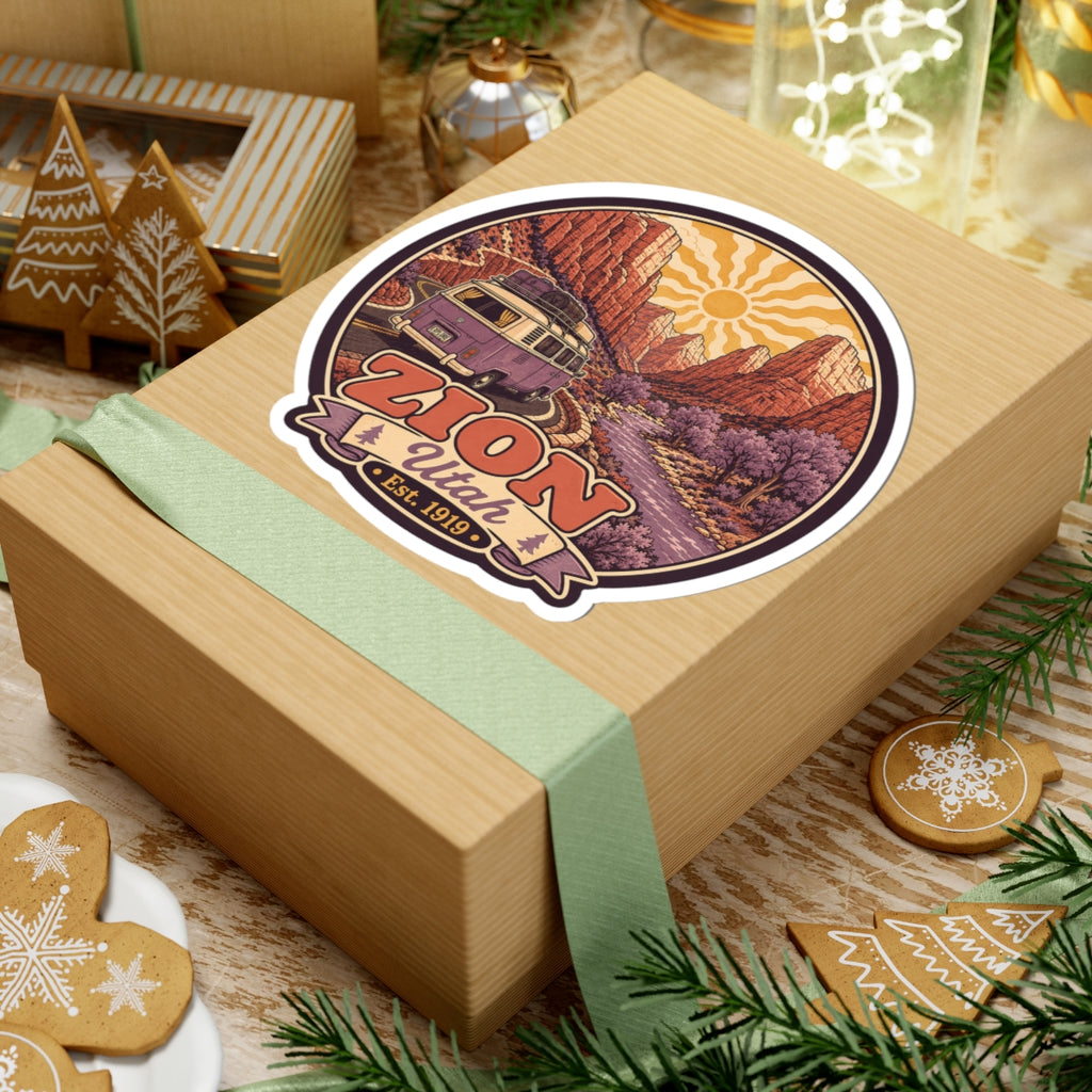 Round Zion Utah decal featuring purple camper van, sunburst sky, red cliffs, and 'ZION' banner