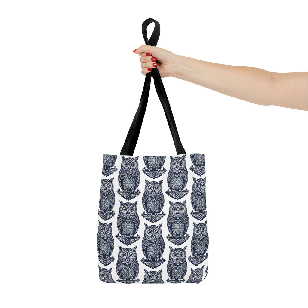 Owl print tote bag with black handles, repeating blue and white owl illustration pattern.