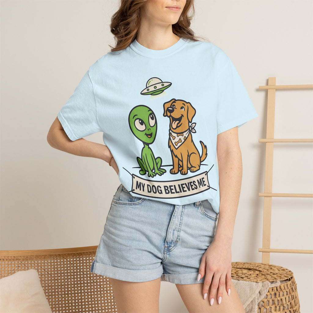 Light blue T-shirt on model with alien and dog graphic and slogan