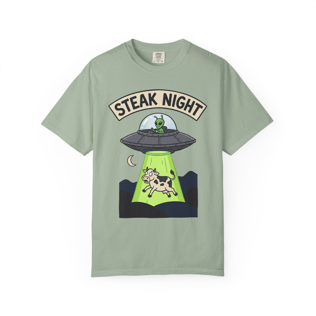 Sage green T-shirt with “Steak Night” alien and cow graphic