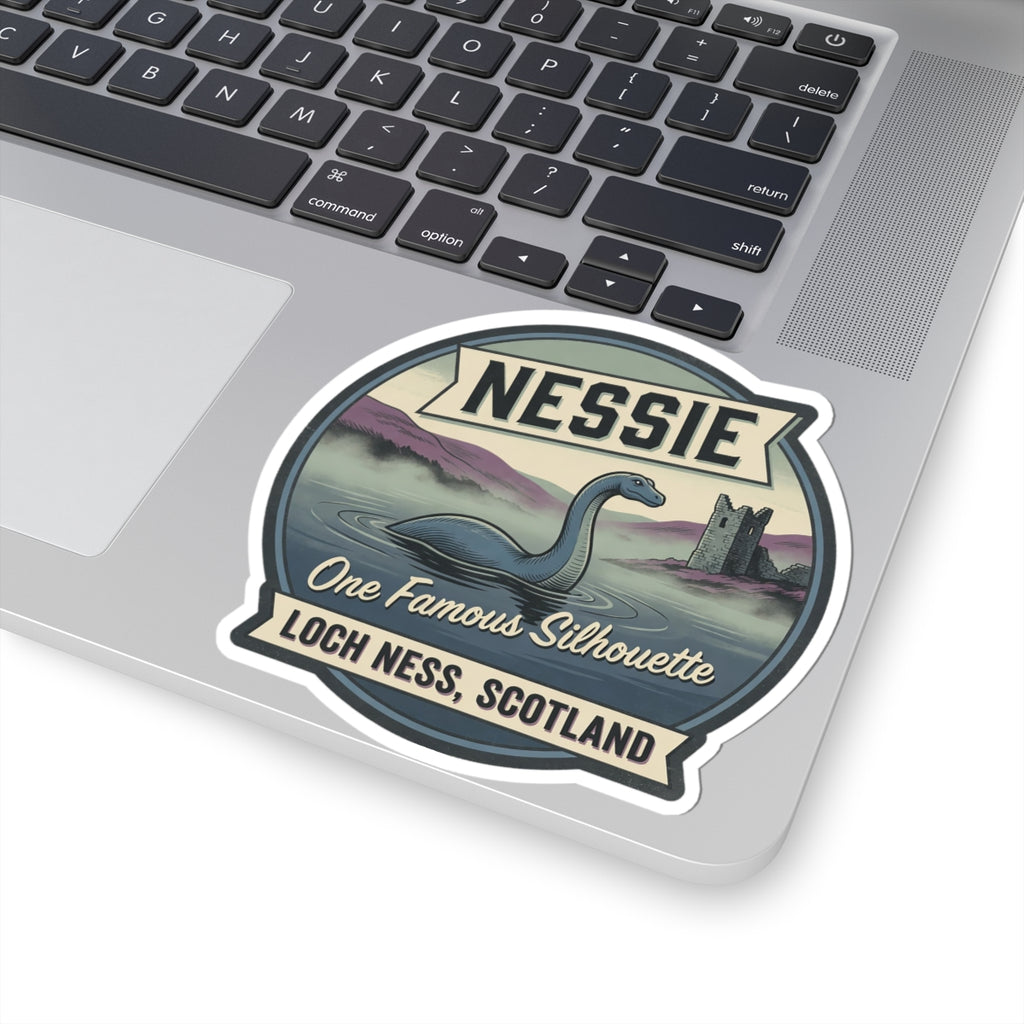 Nessie sticker badge on laptop keyboard, showing Nessie silhouette and “Loch Ness, Scotland”