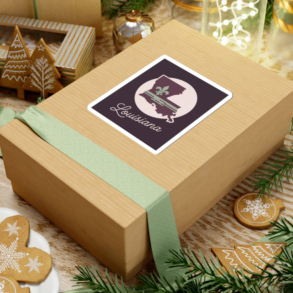 Louisiana silhouette vinyl sticker on wrapped gift box, mauve emblem in white circle