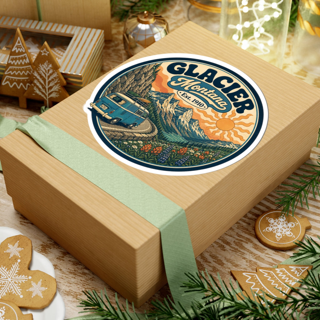 Round kiss-cut sticker featuring Glacier Montana badge, teal camper van on winding path, and flowers