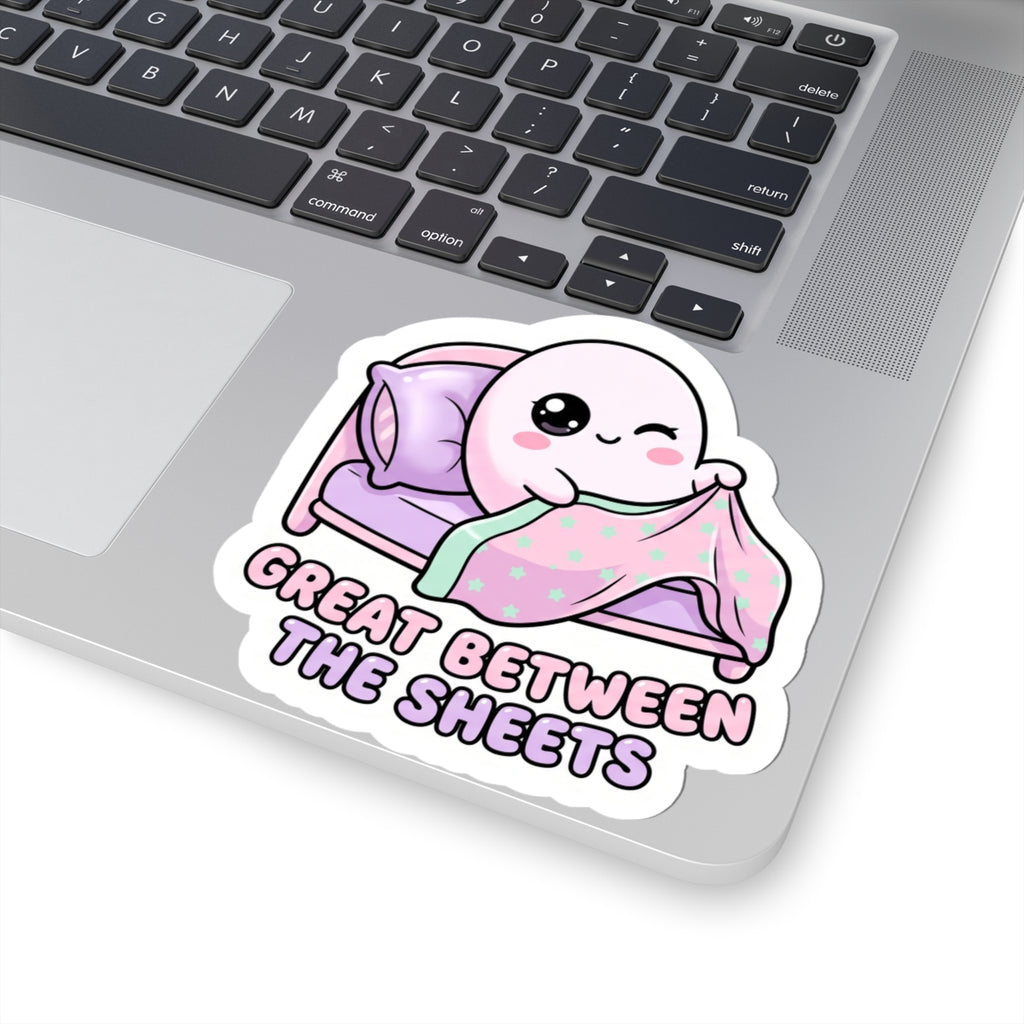 Kiss-cut sticker of cute ghost on purple bed, mint star blanket, “GREAT BETWEEN THE SHEETS”
