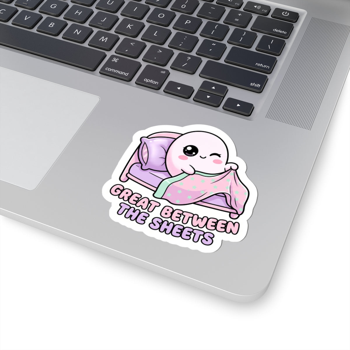 Kawaii bed-ghost kiss-cut sticker, mint star blanket on purple bed, “GREAT BETWEEN THE SHEETS”