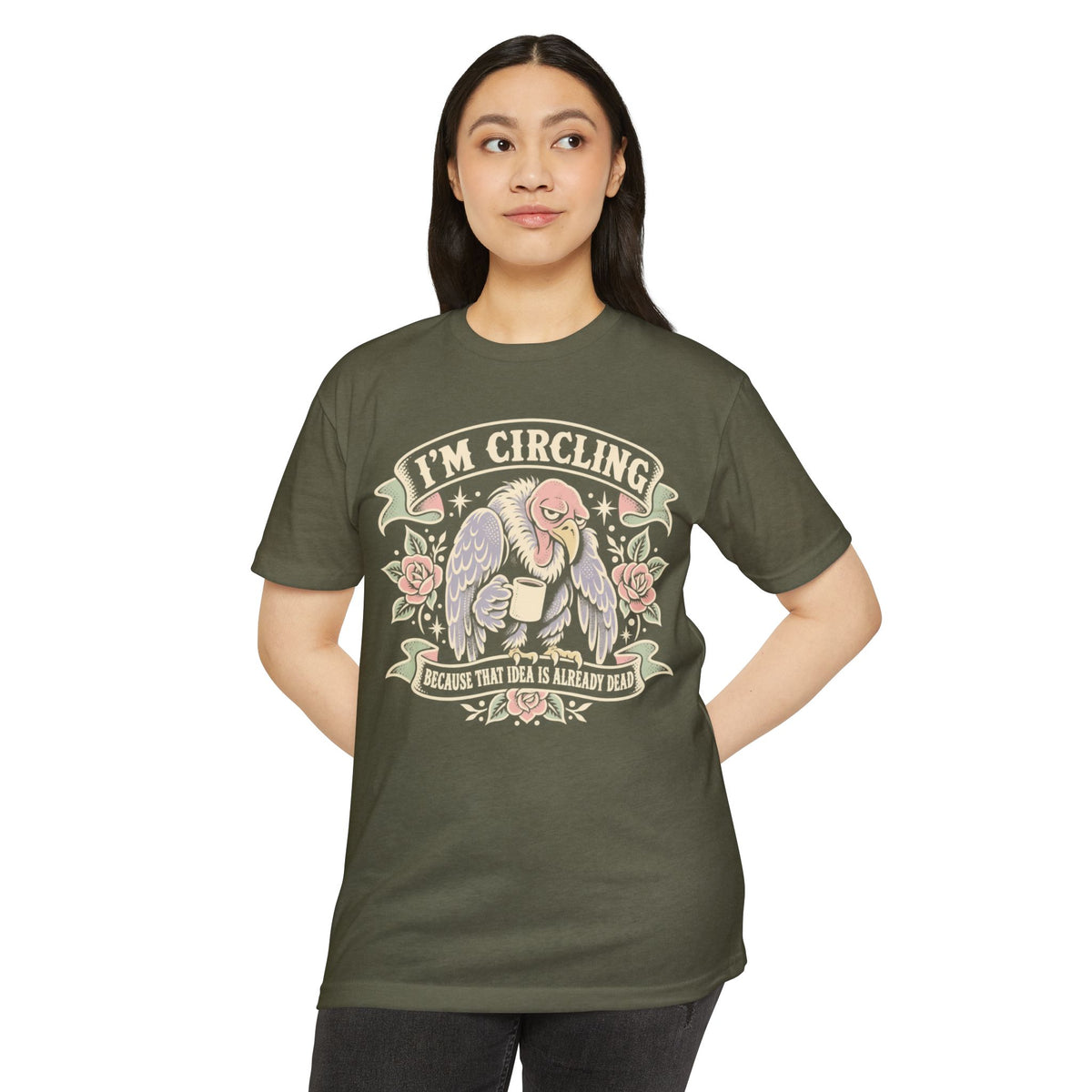 Dark olive graphic t-shirt with 'I'm circling' angel/vulture front graphic
