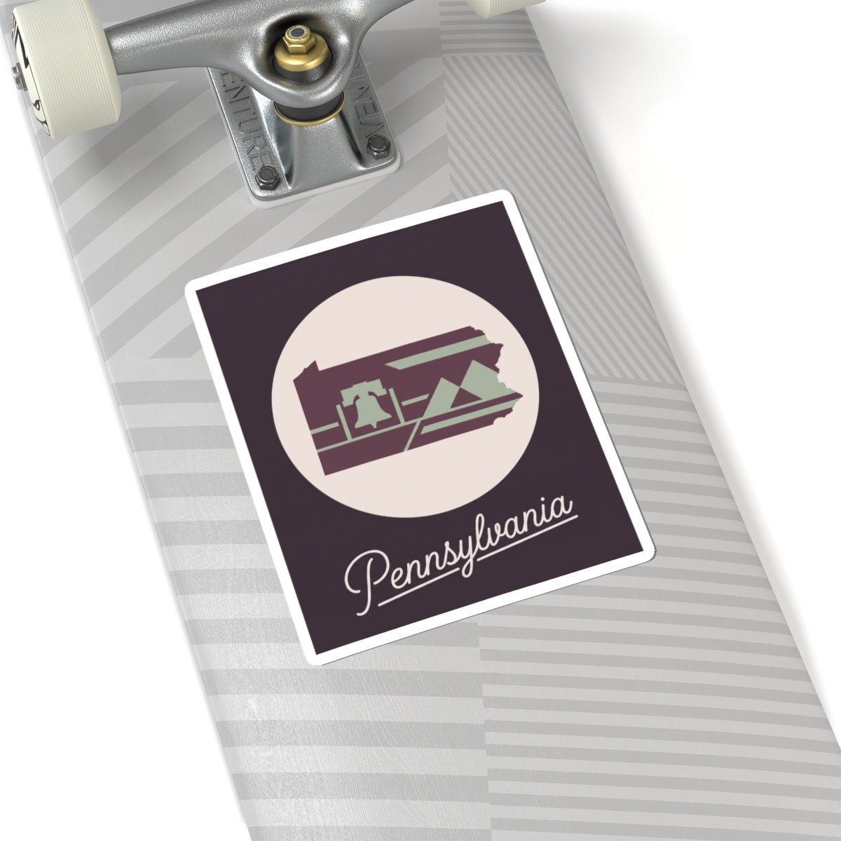 Pennsylvania state silhouette kiss-cut decal on skateboard deck, purple and green with “Pennsylvania”