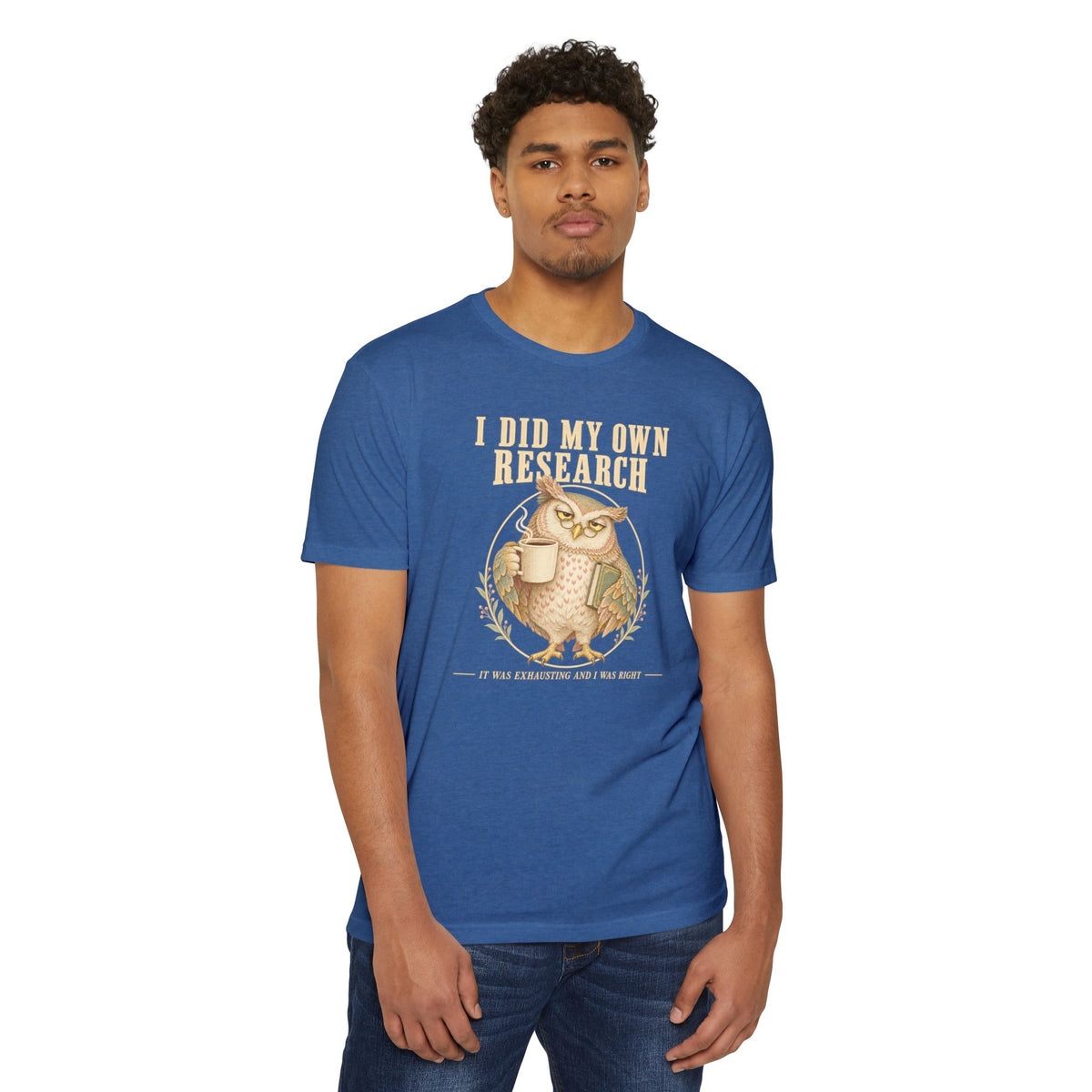 Light blue t-shirt front view on model with owl graphic and research text