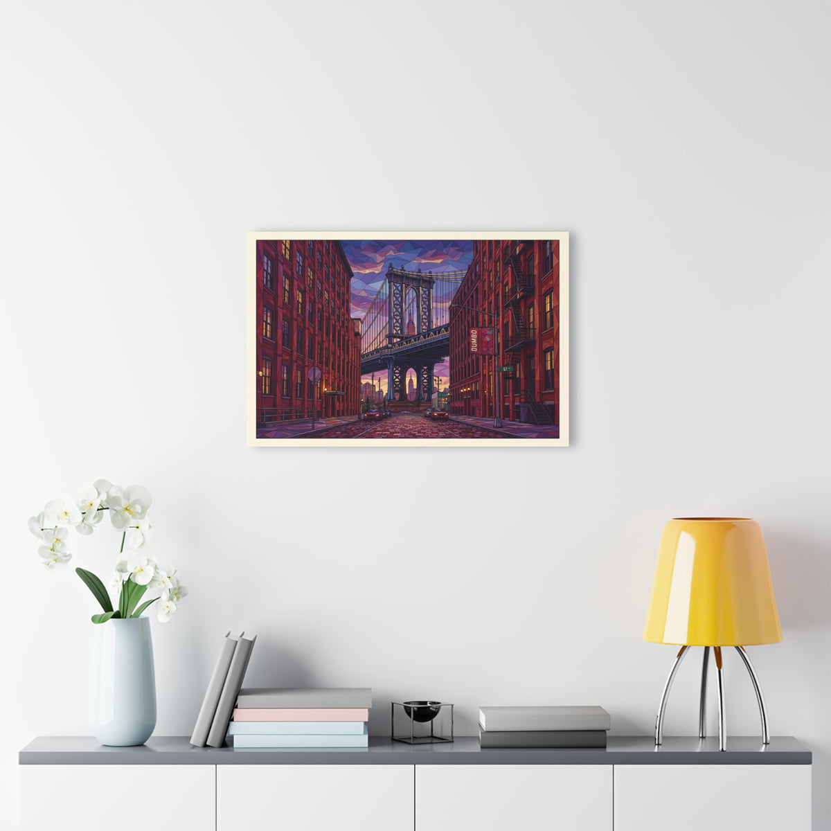 Small acrylic wall art print of an urban bridge street scene, mounted on a light wall.