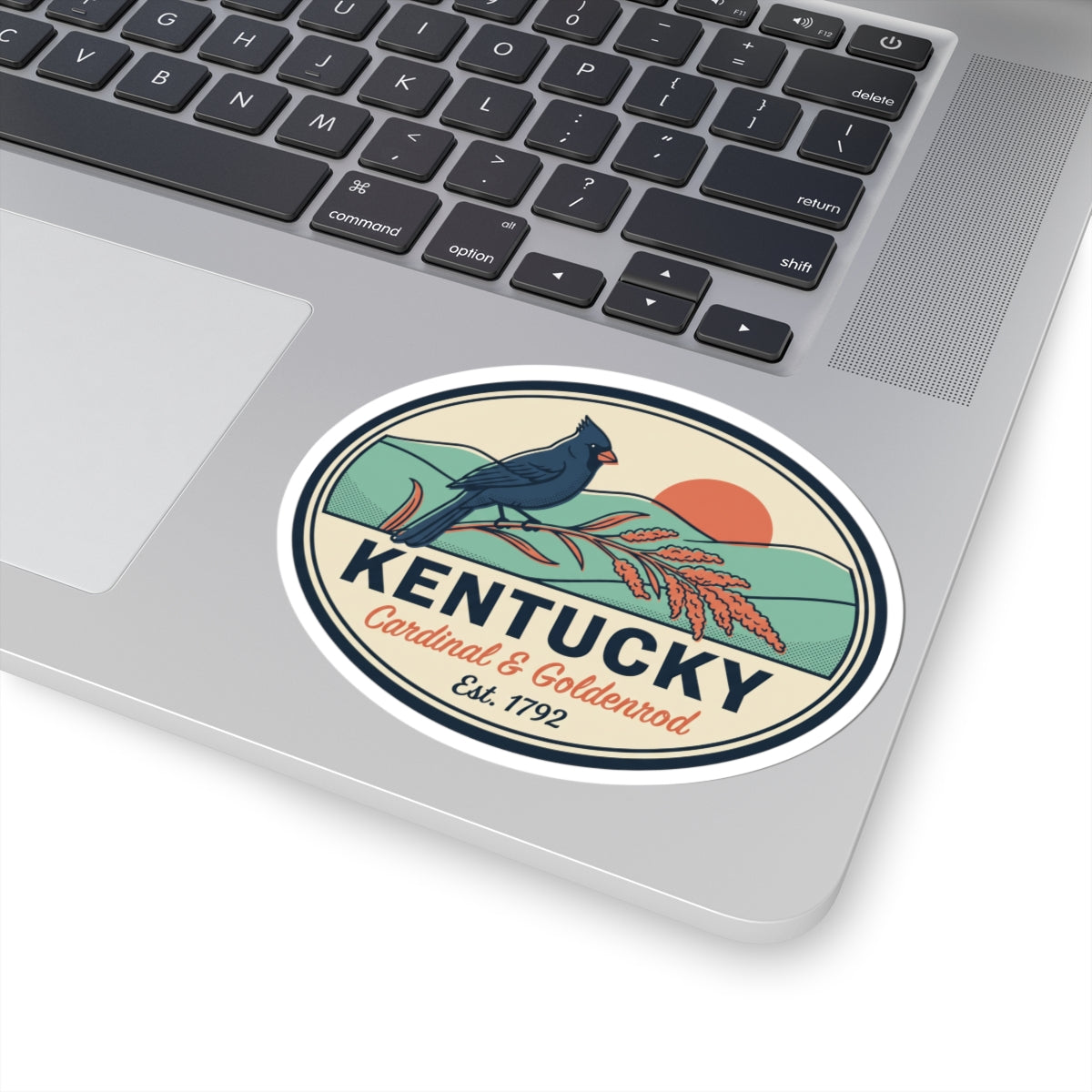 Round vinyl sticker badge showing a blue cardinal beside goldenrod and Kentucky text, Est. 1792.