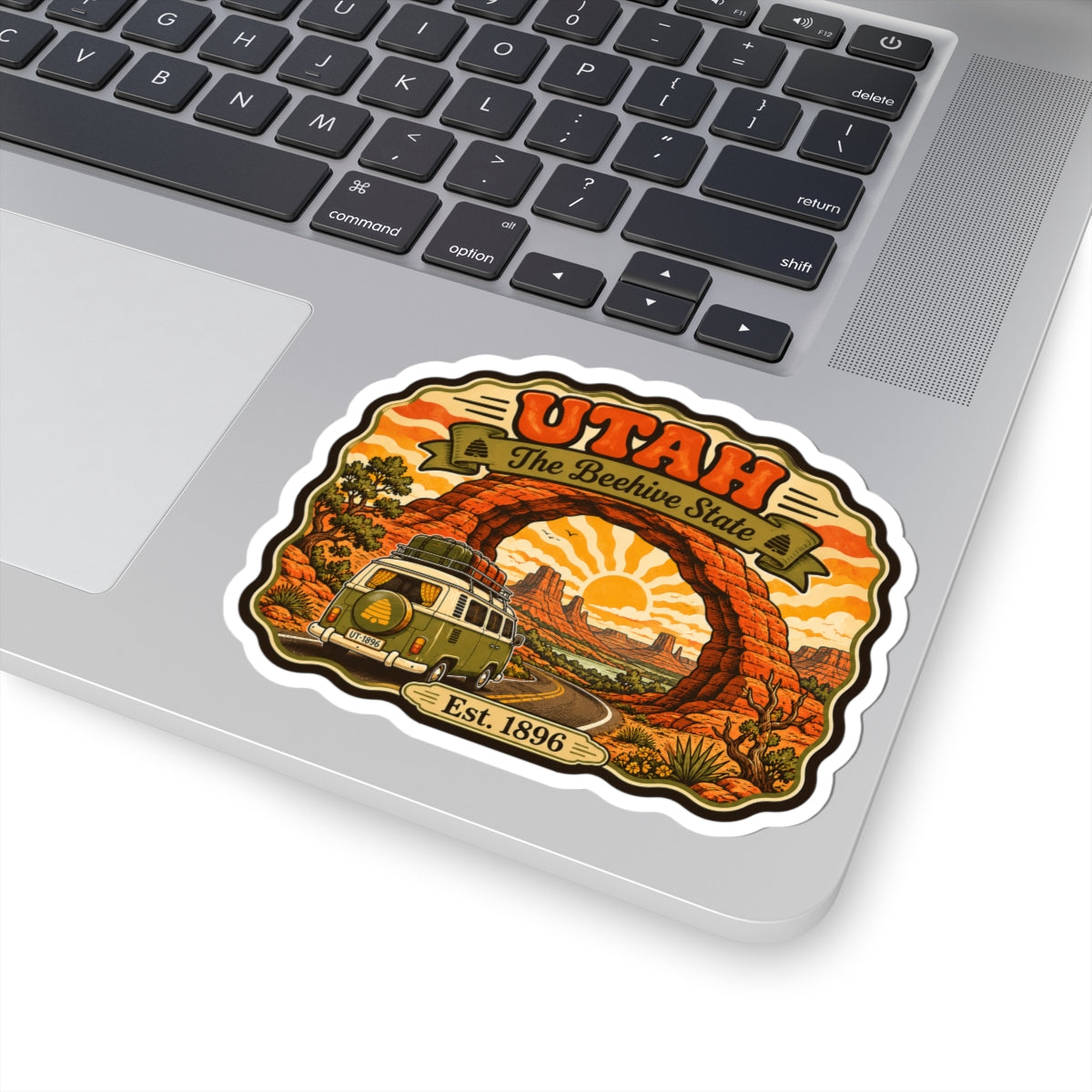 Utah vintage kiss-cut sticker: desert arch, orange sun, road curve, classic van, Est. 1896
