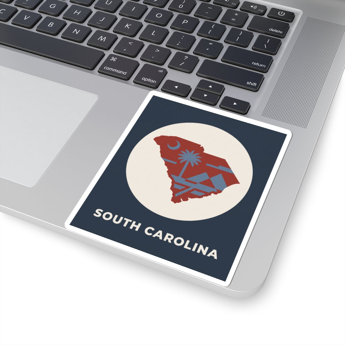 South Carolina map sticker with palm tree graphic in white circle and “SOUTH CAROLINA”