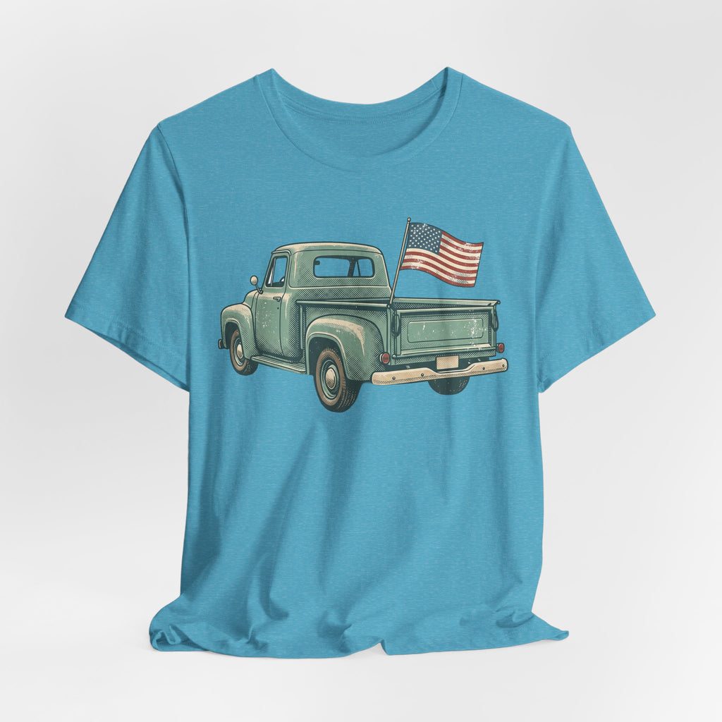 Light blue crewneck T-shirt featuring a vintage green pickup truck with an American flag.