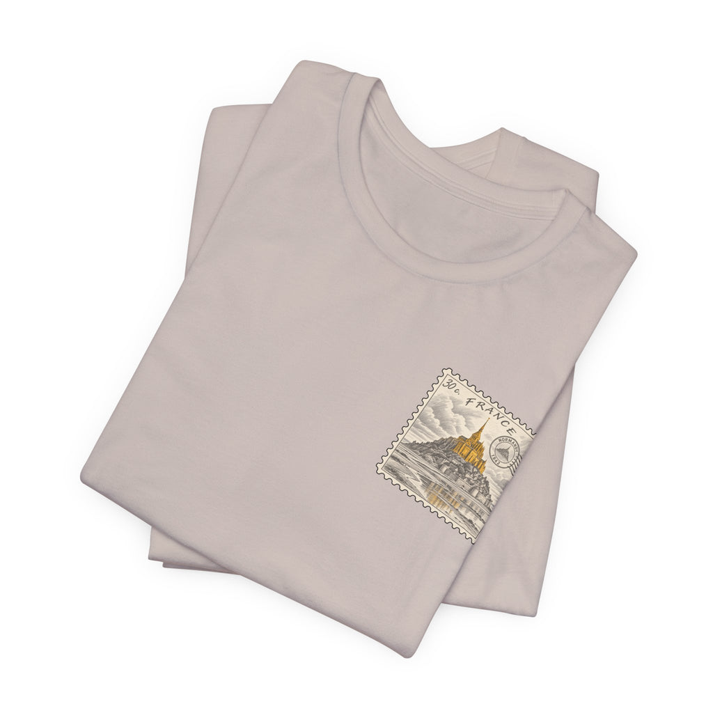 Light pink crew neck T-shirt with small postage-stamp style Mont Saint-Michel graphic