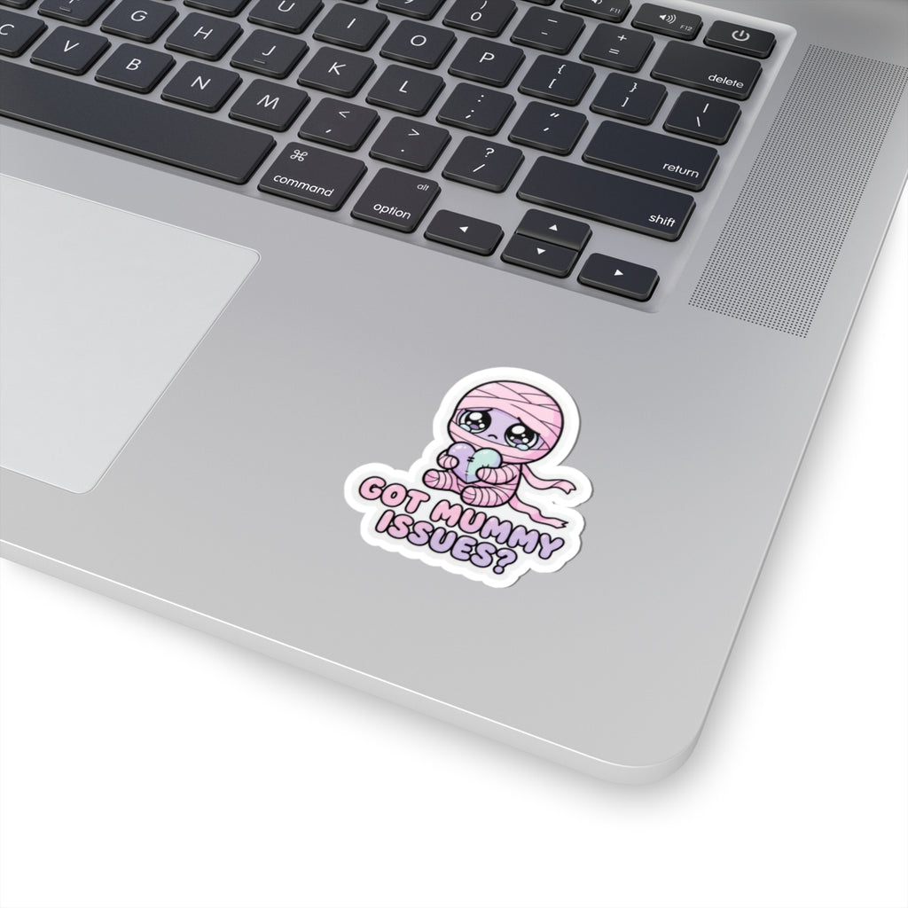 Mini baby mummy holding heart sticker, pink hood, “GOT MUMMY ISSUES?”
