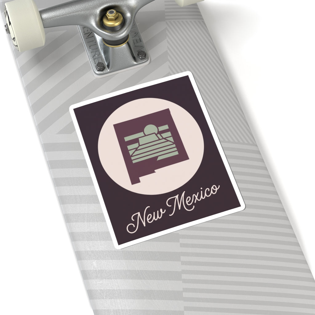 New Mexico sticker decal on suitcase or luggage with circular desert sunrise and “New Mexico” script