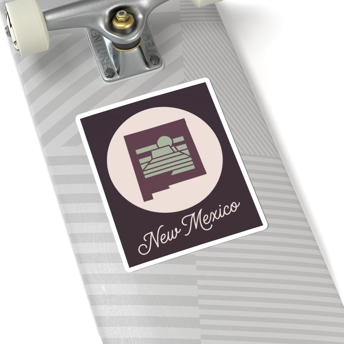 New Mexico sticker decal on suitcase or luggage with circular desert sunrise and “New Mexico” script