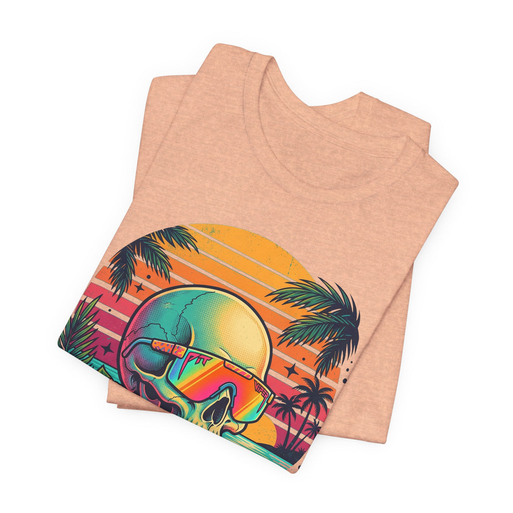 Heather peach T-shirt with tropical skull sunglasses graphic, palm trees and sunset stripes