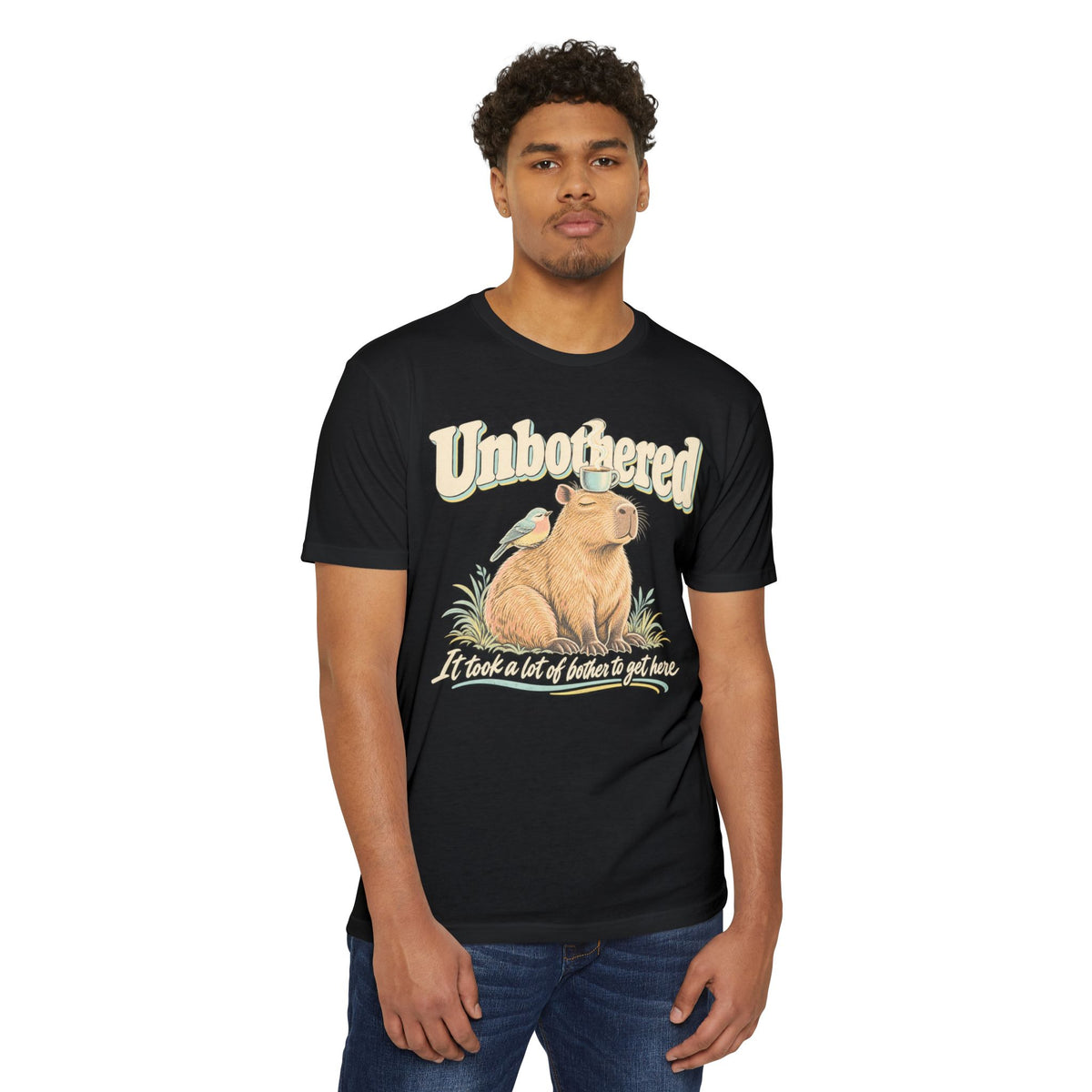 Black crew-neck T-shirt with capybara 'Unbothered' graphic on front