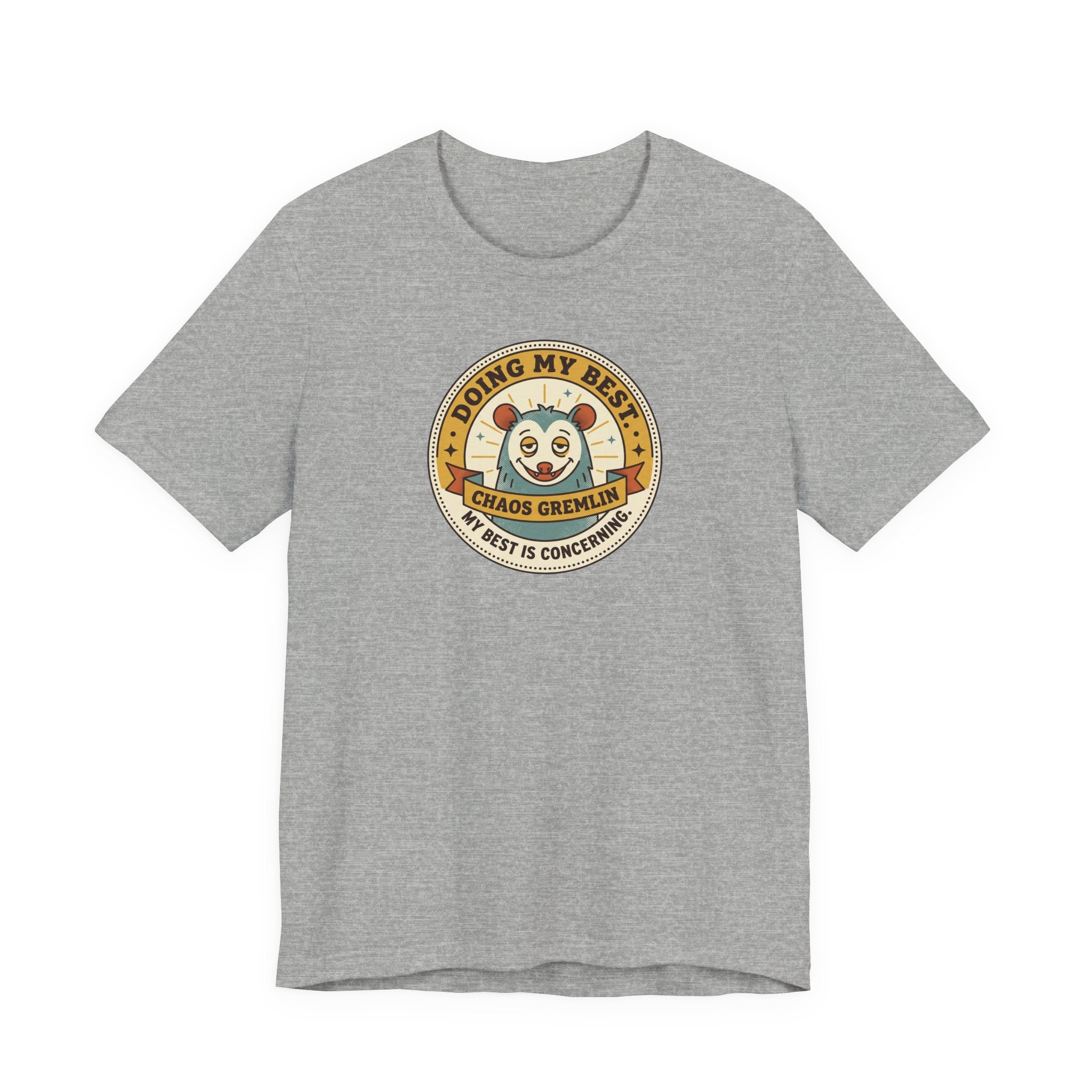 Dark gray T-shirt with round gremlin badge graphic on center chest