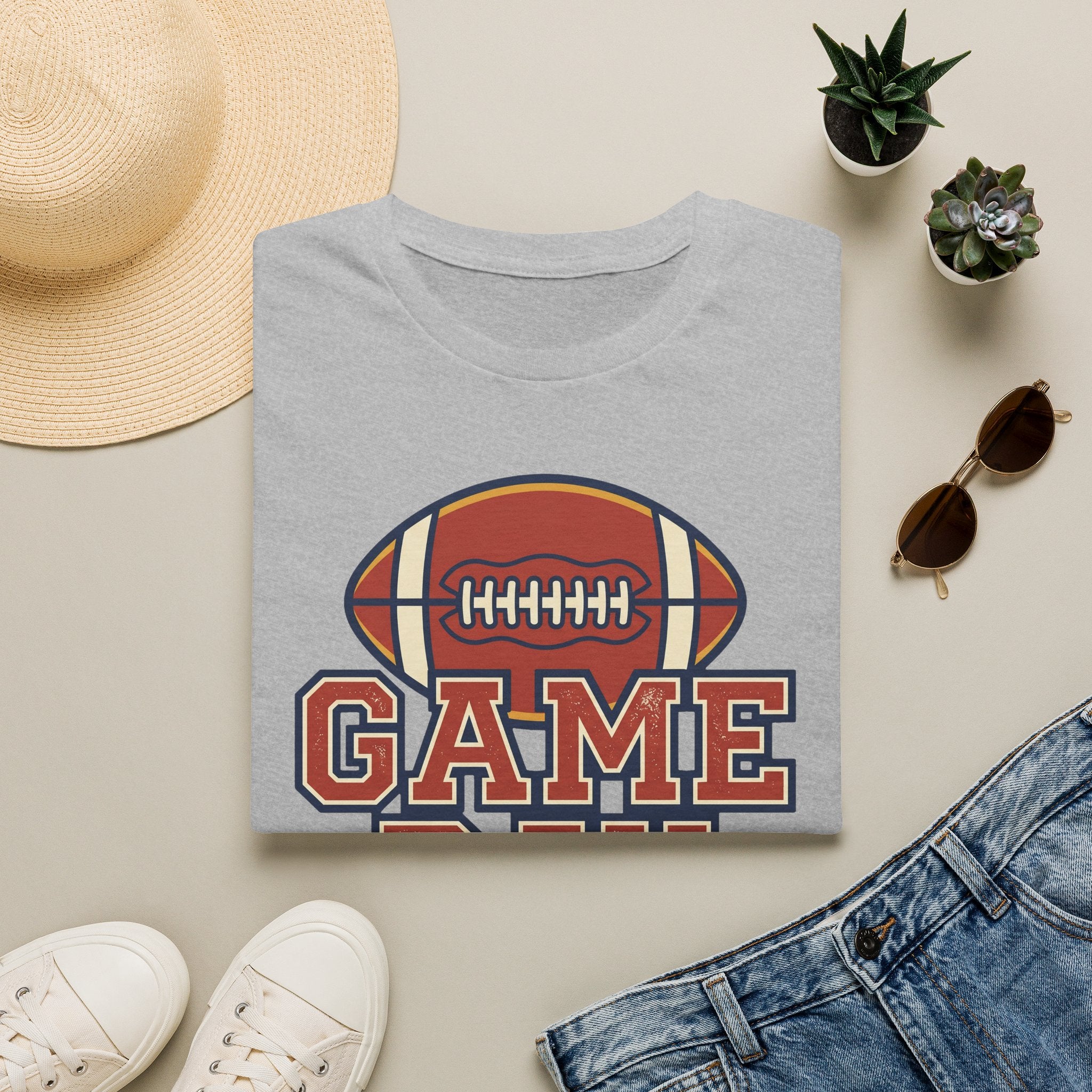Light gray football fan T-shirt with “GAME” graphic and football icon on the chest