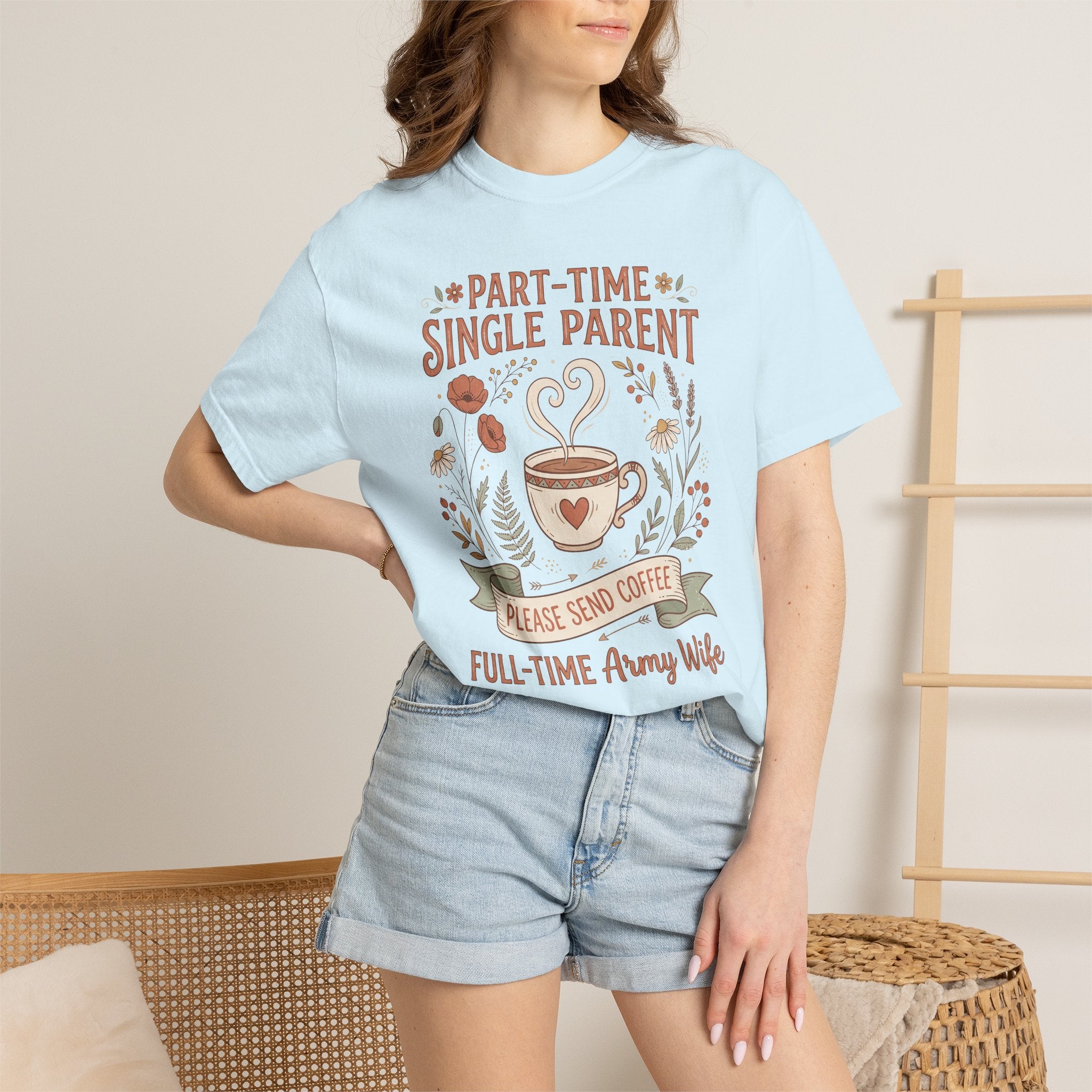 Light blue t-shirt worn by model; front says "Please Send Coffee" with floral coffee mug.