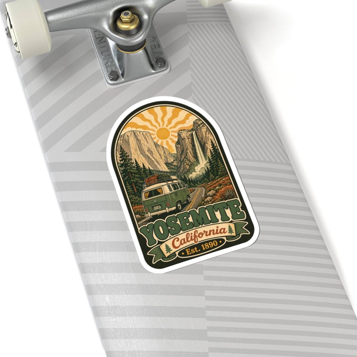 Arched camper van sticker on a suitcase surface, with “Yosemite” text and sun